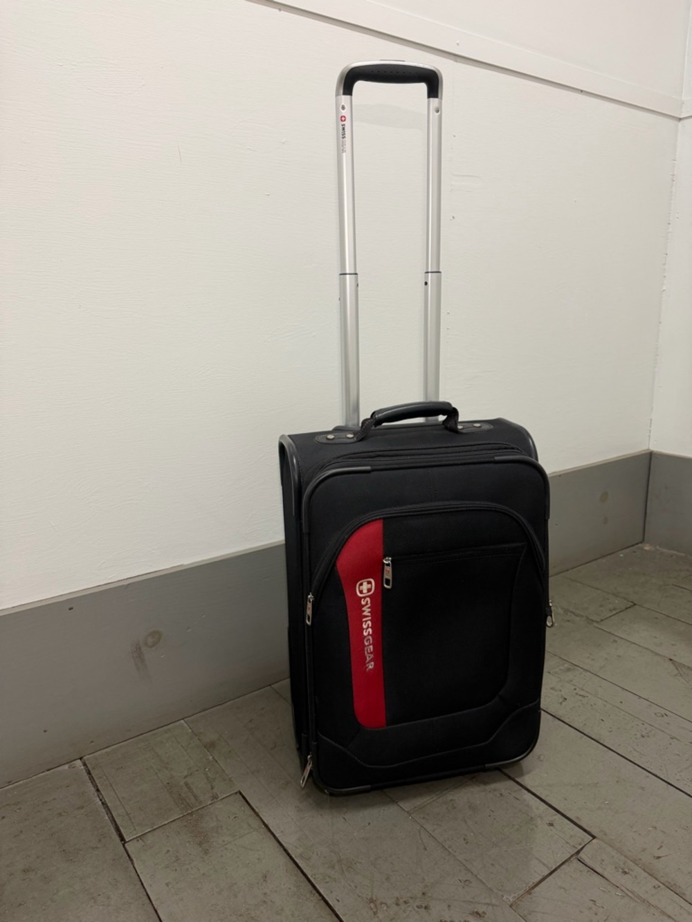 SwissGear Black and Red Upright Carry-On Spinner with Telescopic Handle